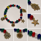 Pulsera Elástica | charms : estrella, ojo turco, flores