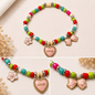Pulsera Elástica | charms : flor, corazón y lazo
