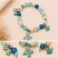 Pulsera Elástica | charms : lazo, perro y corona
