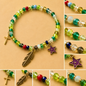 Pulsera Elástica | charms : Cruz, pluma y estrella