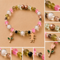 Pulsera Elástica | charms : Flor, niña
