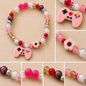 Pulsera Elástica | charms : control y flor