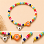 Pulsera Elástica | charms : flor y corazón